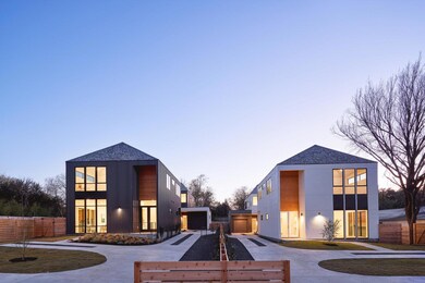 View of building exterior with curved driveway