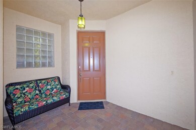 Front entry with outdoor covered sitting area to t