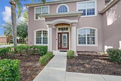 Doorway to property featuring stucco siding