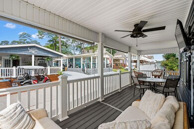 Deck with outdoor dining area, ceiling fan, and co