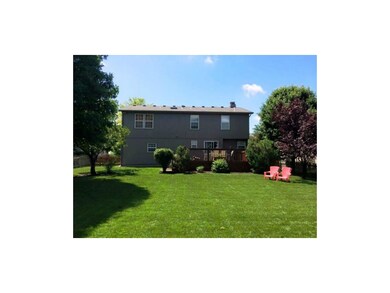 Treed Lot with Wood picket Fence & large deck.  Ph