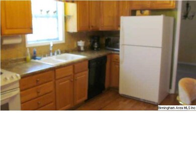 UPDATED KITCHEN WITH NEW COUNTERTOPS AND TILE BACK