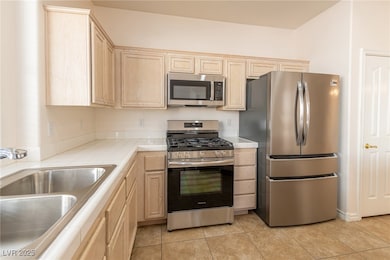 Kitchen with appliances with stainless steel finis
