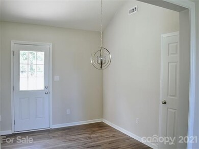 Dining room, closet and back door to patio