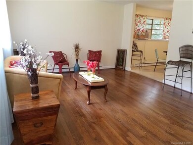 View of living room and kitchen from front door