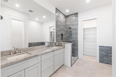 Both bedrooms offer ensuite bathrooms and walk-in