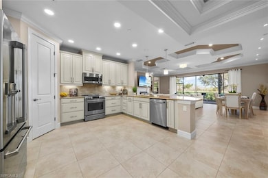 Kitchen with hanging light fixtures, crown molding