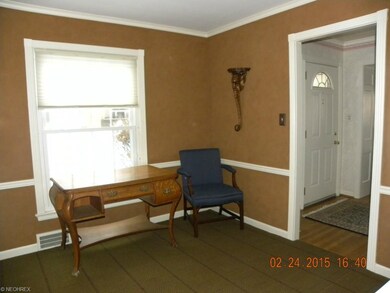 Office in front of house with built in bookcases