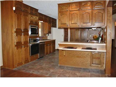 Kitchen features lovely wood work, new flooring, m