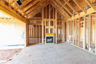 Miscellaneous room featuring lofted ceiling