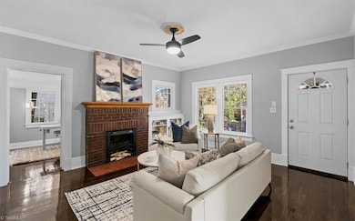 Living Room with fireplace. Office thru the doorway. Front door to the right.