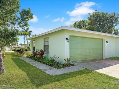 View of side of property with an attached garage,