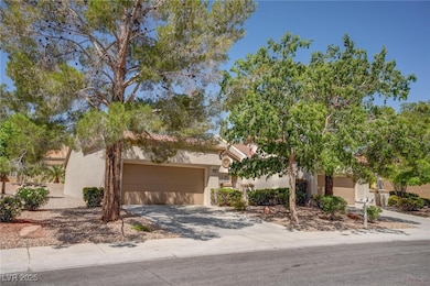 Obstructed view of property with concrete driveway