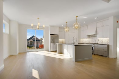 Kitchen and Dining area with oversized patio doors leading to your maintenance free deck