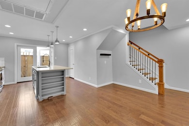 Kitchen Island with sink, showing doors to back pa