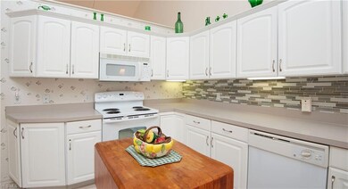Another view of the kitchen. The butcher block tab