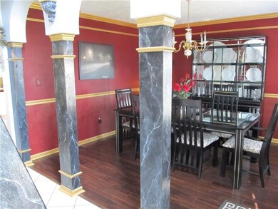 Pillars Embrace Formal Dining Room