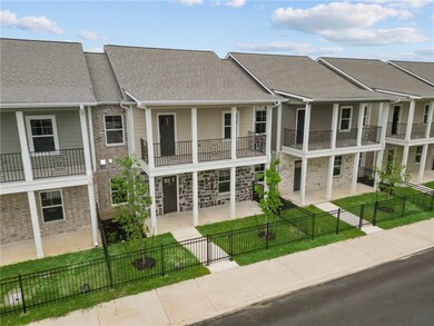 View of building exterior with a fenced front yard