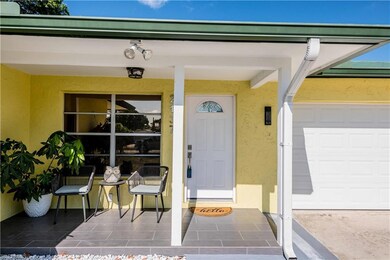 Ranch-style home with concrete driveway, stucco si