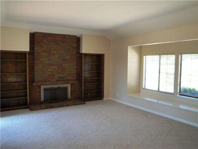 Spacious Living Room with Fireplace and Window Sea