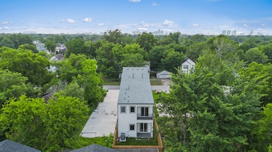 Rear aerial view highlighting fenced backyard