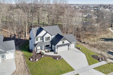 1449 Chase Farms Dr unit 22, Byron Center, MI 49315 - photo 3