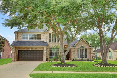 Gorgeous trees line up the home.