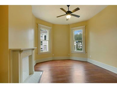 Bedroom. Lots of natural light, beautiful wood flo
