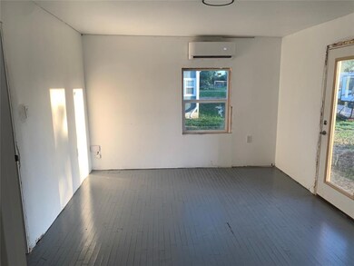 Spare room with dark hardwood / wood-style floors 