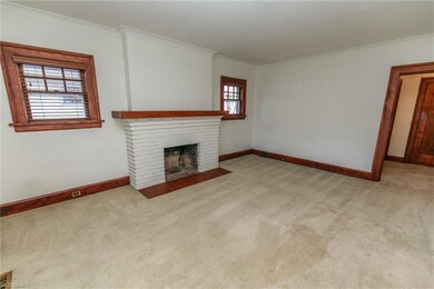 The living room is highlighted by the fireplace wi
