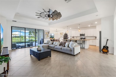 Living room with light tile patterned flooring, ce