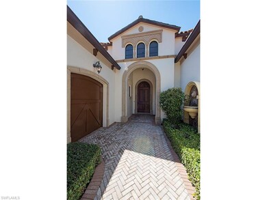 Precast stone detail with mahogany entry door and 