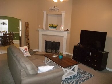 Vaulted Great Room with Gas Log Fireplace.      Ph
