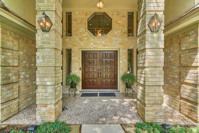 Gorgeous hardwood double doors with covered porch.