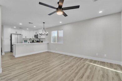 Unfurnished living room with recessed lighting, li