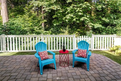 Backyard is fenced & perfectly sited with an oversized patio and ultimate privacy, backing to community owned green space.