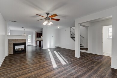 Unfurnished living room featuring dark laminate fl