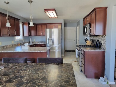 The kitchen has lots of cabinets with all of the a