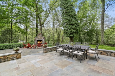 Oversized, two-tiered patio with outdoor fireplace