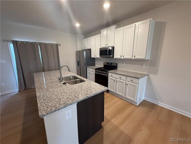 Kitchen with appliances with stainless steel finis