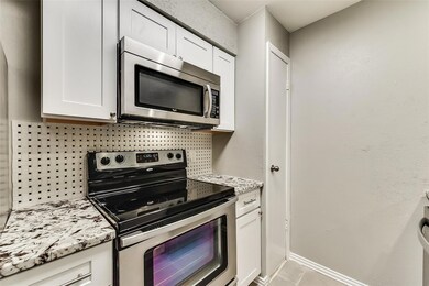 Kitchen with appliances with stainless steel finis