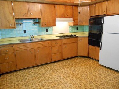Ample space in this large kitchen for a standard-s