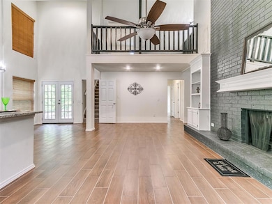 Unfurnished living room with a high ceiling, a cei