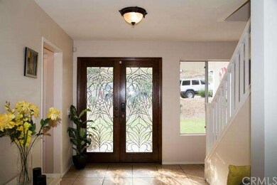 Lovely view of beveled-glass doors and foyer