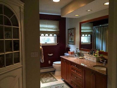 Bathroom. Large Quartz tiled bath with double sink
