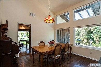 Dining room has hardwood flooring and is accented 