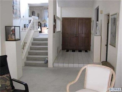 Looking at front entrance= Double doors. MBR to le