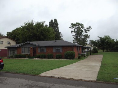 right side of the house with one of the two driveways