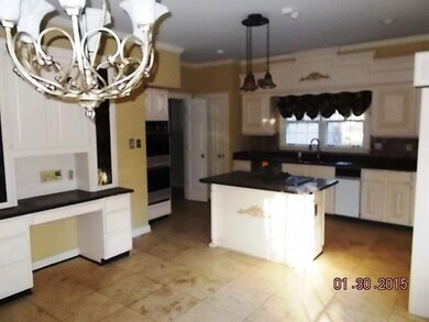 THERE ARE TWO PANTRIES. THE DOOR IN REAR OF PHOTO 
