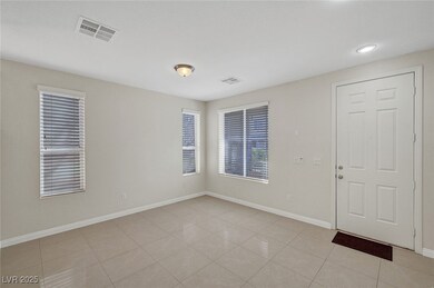 Spare room with light tile patterned floors, visib